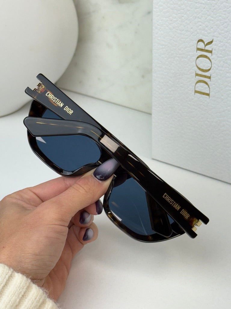Havana brown Dior sunglasses side view with blue lenses and gold hinge detail