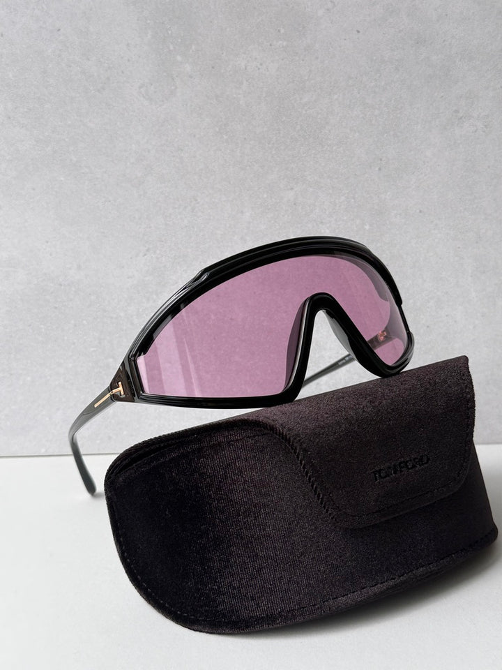 Black sunglasses with pink-tinted lenses and black protective pouch