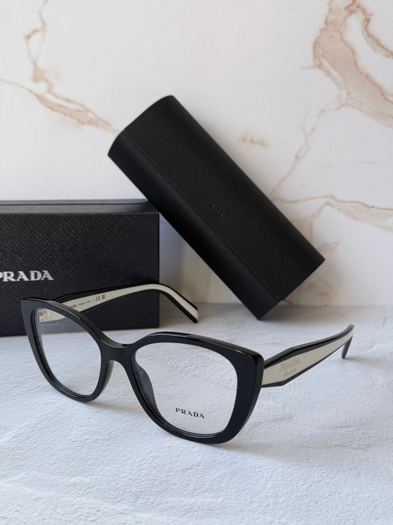 Black cat-eye eyeglasses frames with clear lenses and white temple accents.