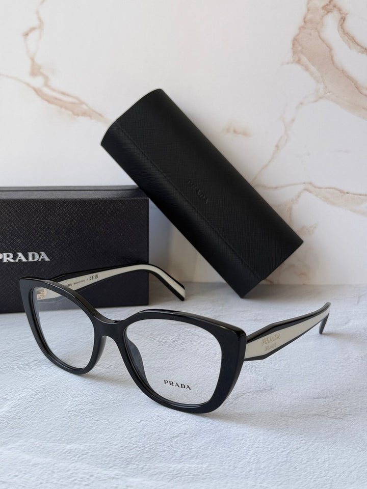 Black cat-eye eyeglasses frames with clear lenses and white temple accents.