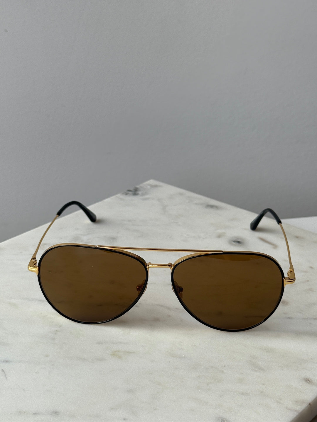 Gold-tone aviator sunglasses with brown lenses, front view
