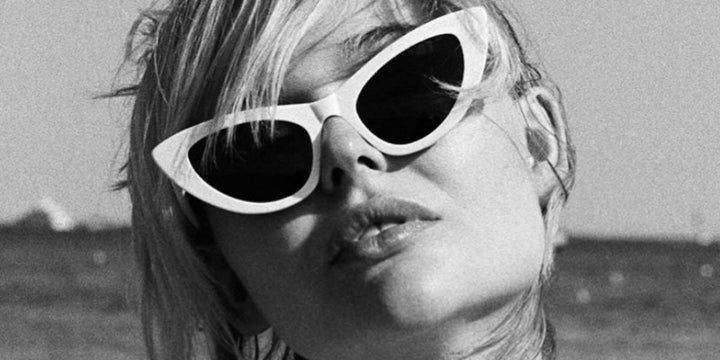 Saint Laurent Lily cat-eye sunglasses on model, white frames and black lenses