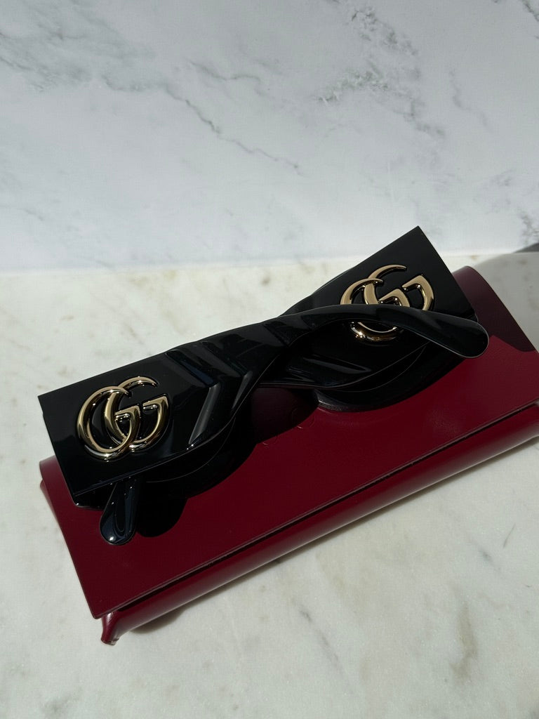 Black quilted rectangular sunglasses, GG logo on front of temple, dark lenses