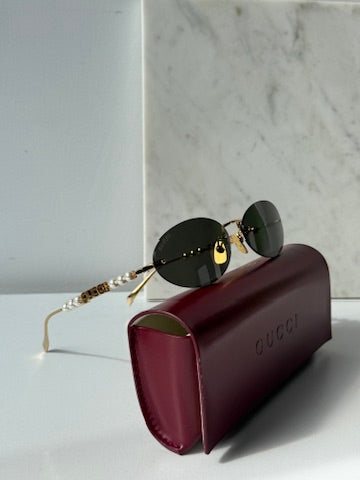 Gucci GG1257S Gafas de sol redondeadas con lentes marrones y rojos