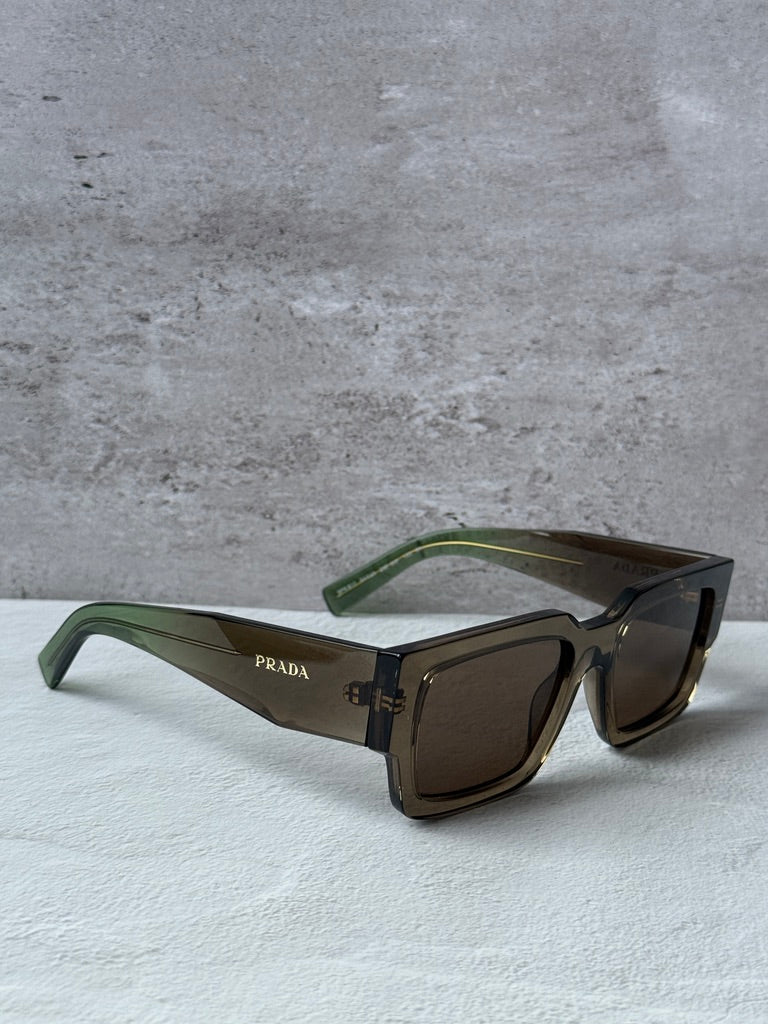 Prada rectangular sunglasses with transparent brown frames, dark brown lenses, green temples