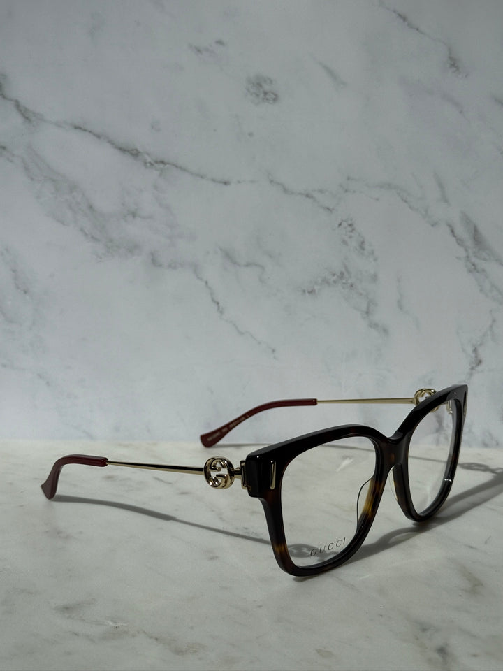 Gucci Havana brown eyeglasses, side view with gold hinge detail