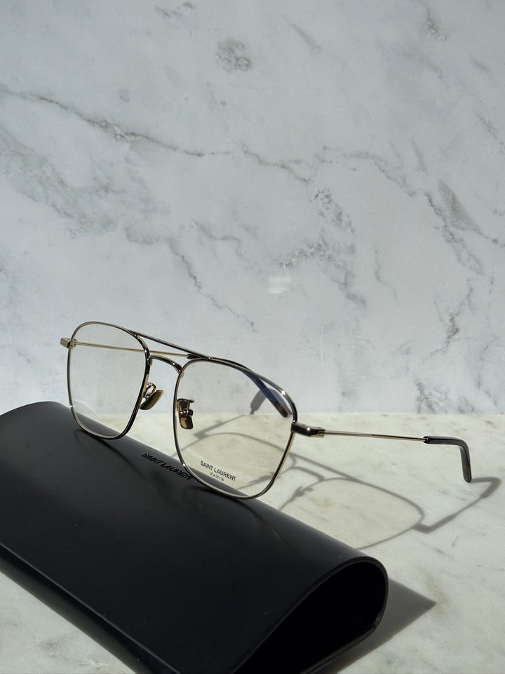 Gold aviator eyeglass frames with clear lenses and adjustable nose pads.
