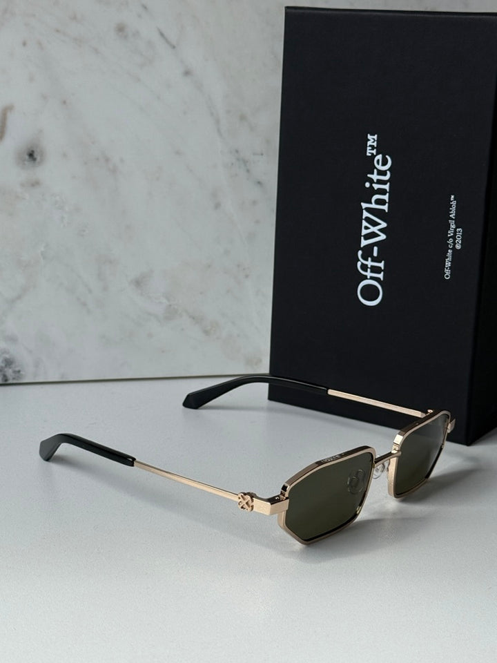 Off-White loa sunglasses with gold frame, dark green lenses, and black temples.