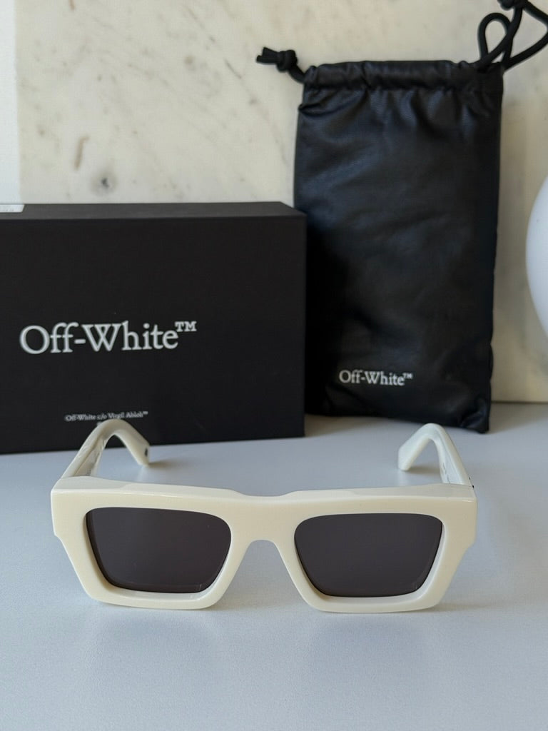 White square sunglasses with dark lenses and Off-White logo, shown with box