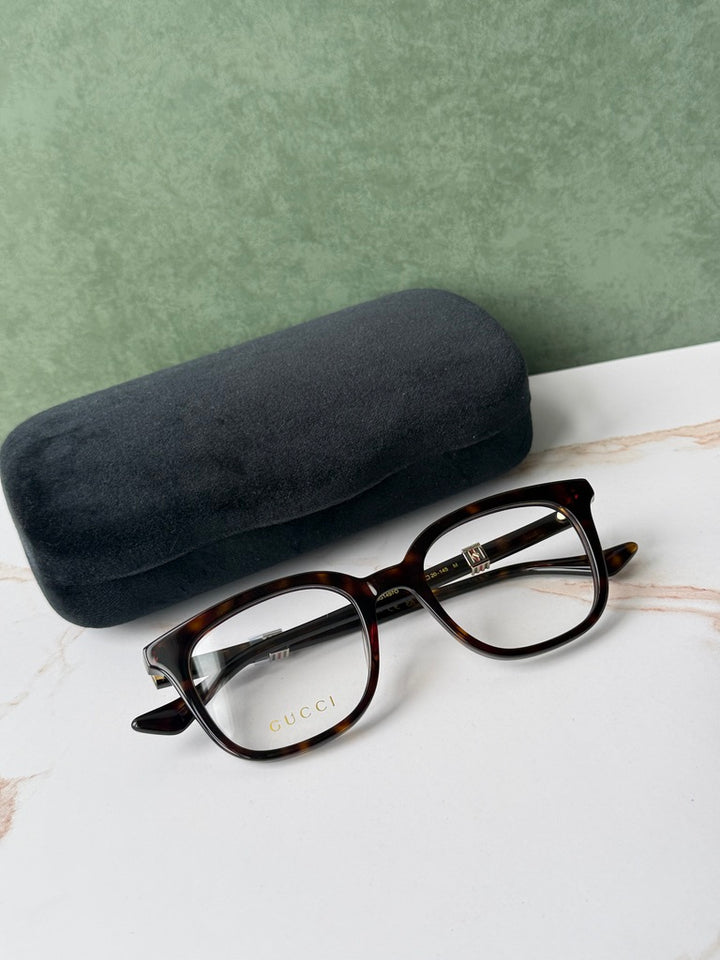 Havana brown square eyeglass frames with dark protective case