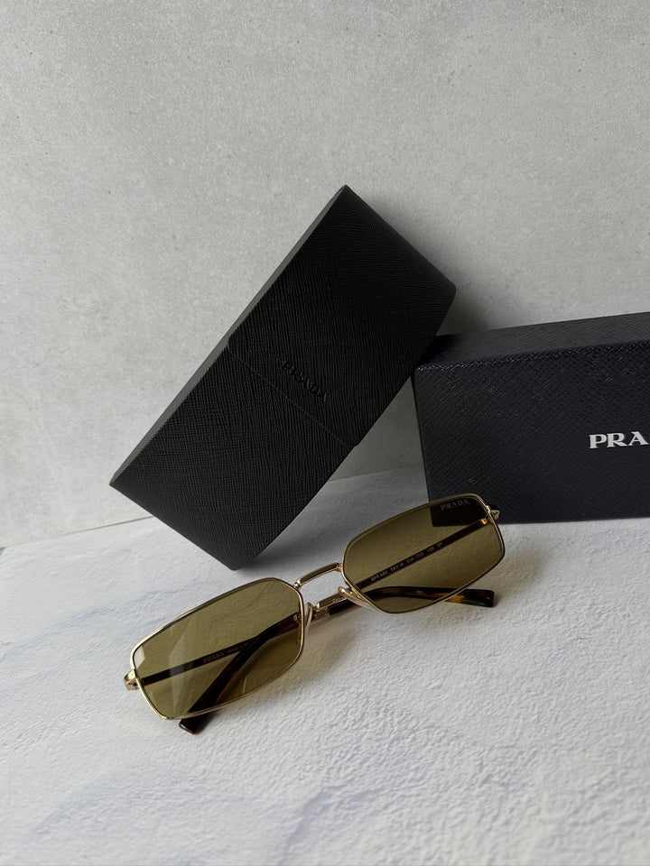 Gold metal rectangular sunglasses with brown-tinted lenses, with black protective case.