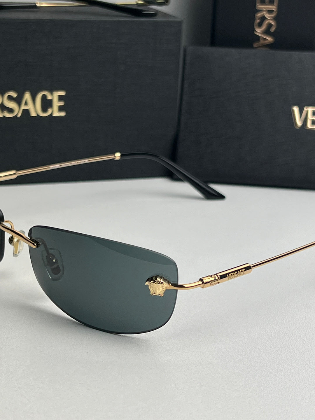 Versace VE2279 Rimless Sunglasses in Gold Grey