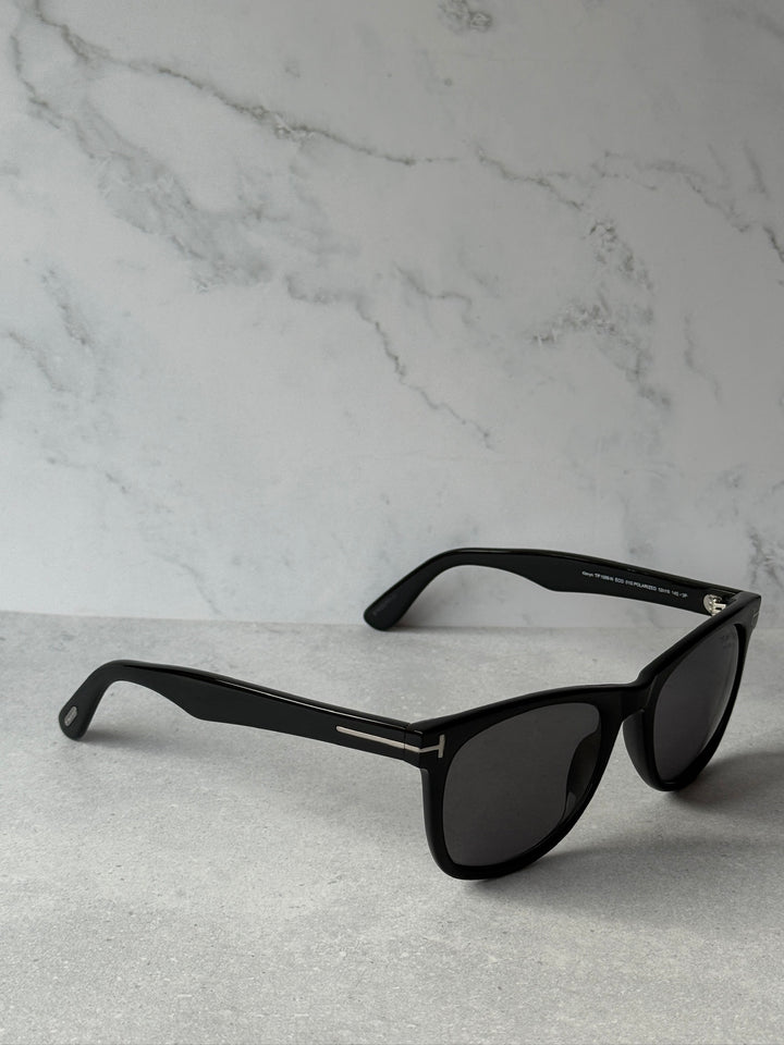 Black sunglasses with dark polarized lenses and slim temple arms