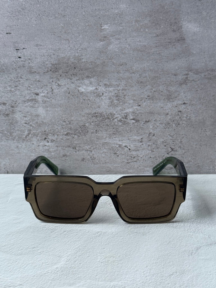 Prada square sunglasses with transparent brown frames and dark brown lenses
