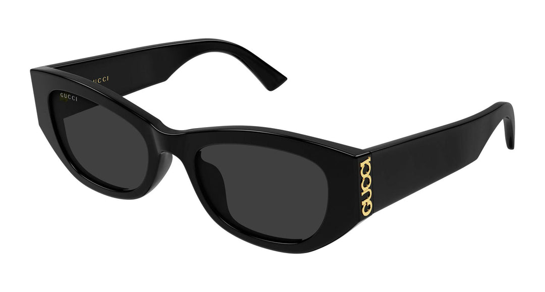 Black slim Gucci sunglasses with dark lenses and gold GG temple detail