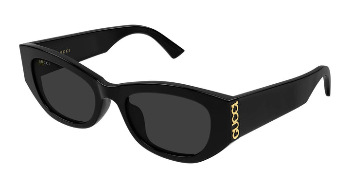 Black slim Gucci sunglasses with dark lenses and gold GG temple detail