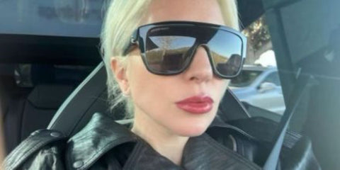 Black square sunglasses with dark tinted lenses and skull-detail temple arms
