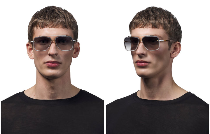 Dita aviator sunglasses on model, yellow gold thin frame with dark lenses
