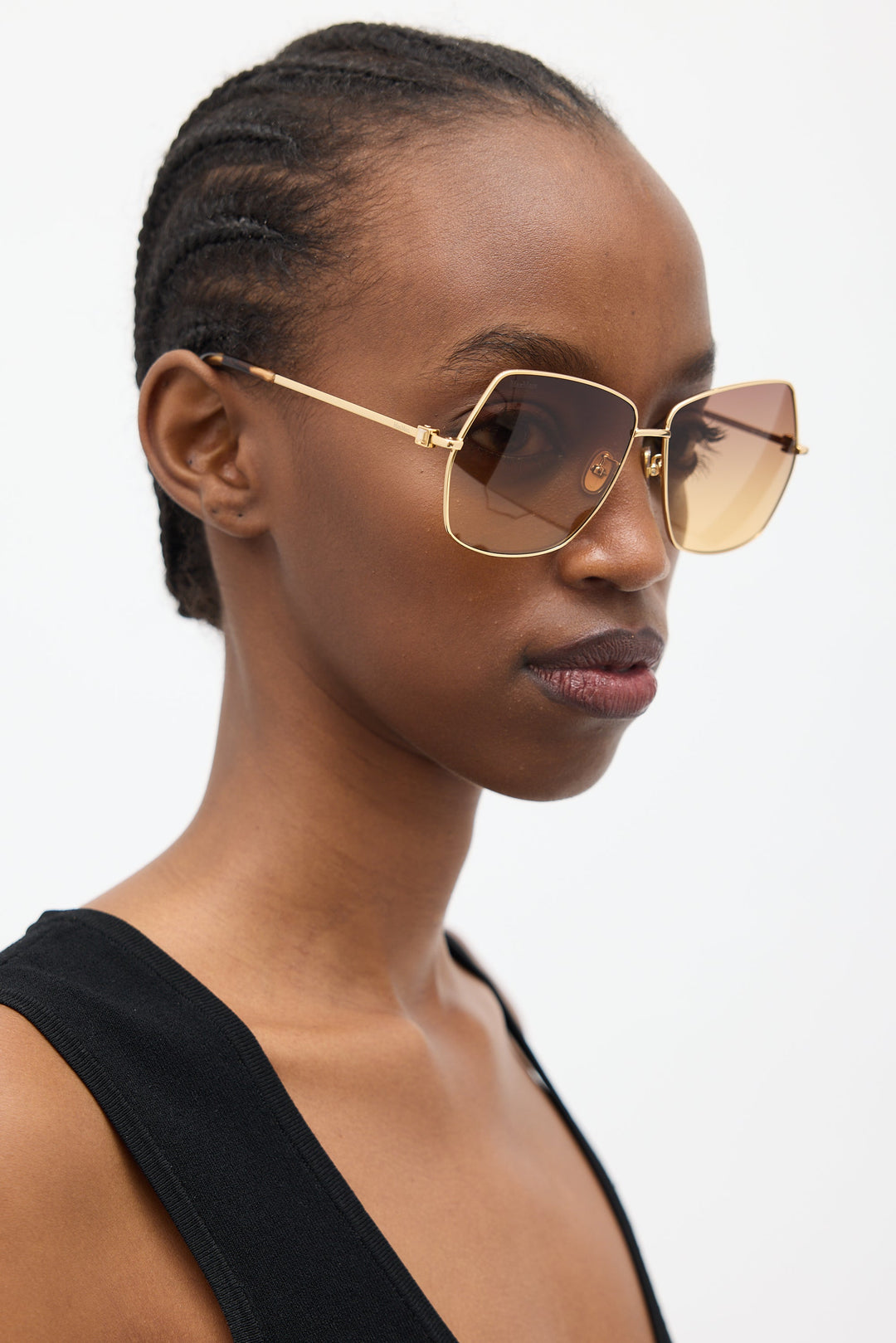Gold rectangular sunglasses with brown lenses and tortoise-accented arms