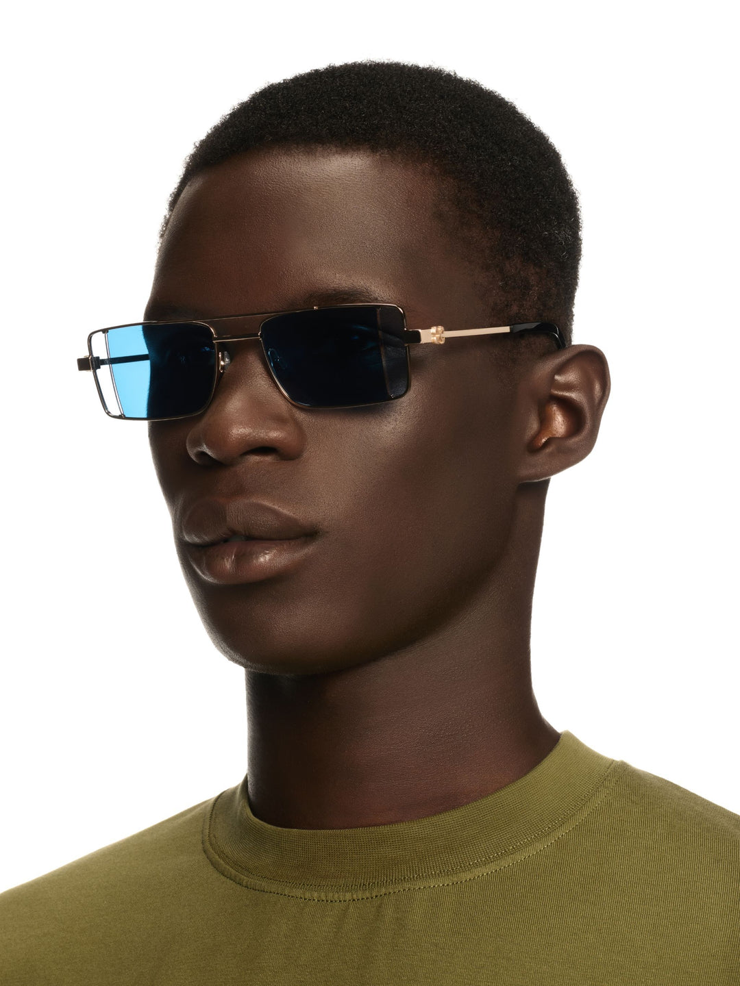 Off White Cortez sunglasses on face, gold frame with blue-tinted lenses