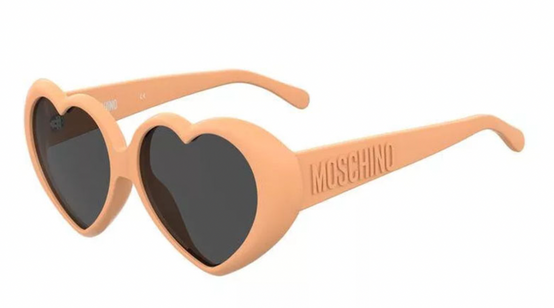 Orange heart-shaped Moschino sunglasses with dark lenses and logo arms
