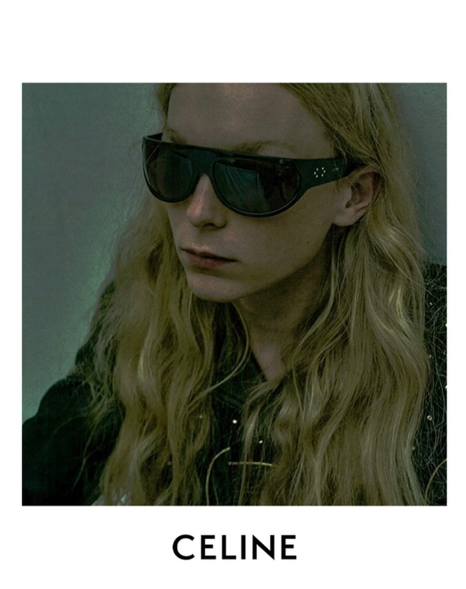 Black wrap sunglasses with dark lenses and Celine logo on temple