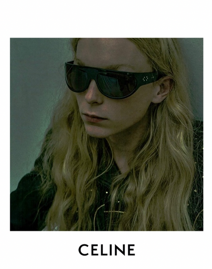 Black wrap sunglasses with dark lenses and Celine logo on temple