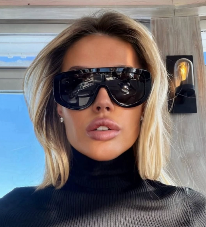 Gucci GG1257S Gafas de sol redondeadas con lentes marrones y rojos