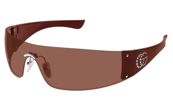 Rimless burgundy sunglasses with tinted lenses, metal bridge, and dotted temple detail