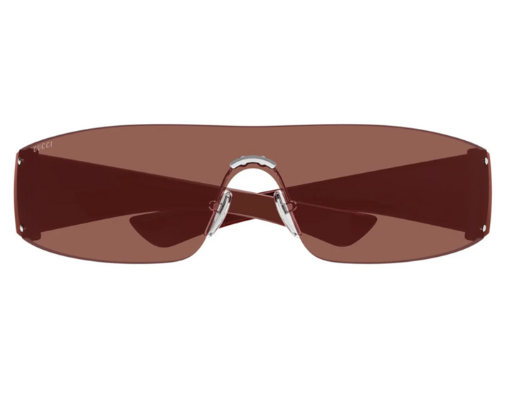 Rimless burgundy sunglasses with wide tinted lenses and metal bridge