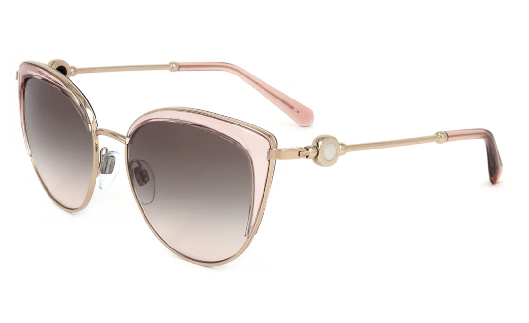 Gold and pink cat-eye sunglasses with dark gradient lenses, metal temples