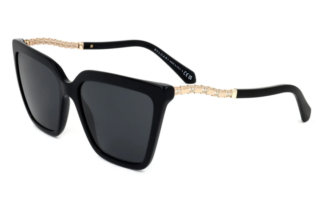 Black cat-eye sunglasses with dark lenses and gold chain temple detail