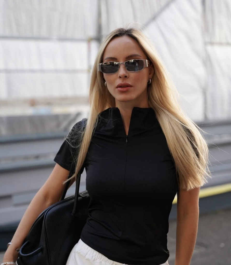 Saint Laurent SL738 sunglasses on model, dark gray lenses and silver frames