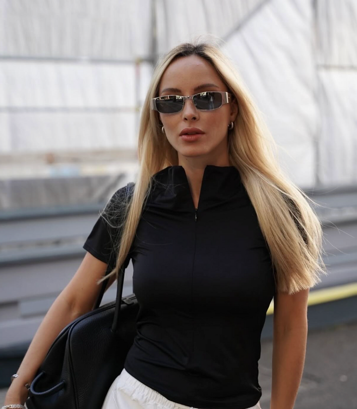 Saint Laurent SL738 sunglasses on model, dark gray lenses and silver frames