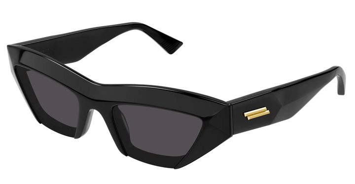 Black cat-eye sunglasses with dark lenses and gold logo accent on the frame