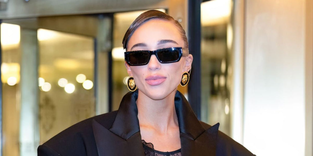 Saint Laurent SL660/F black sunglasses on a woman, dark rectangular lenses