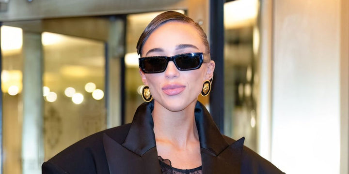 Saint Laurent SL660/F black sunglasses on a woman, dark rectangular lenses