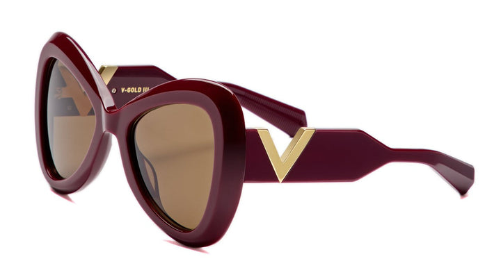 Valentino burgundy red sunglasses, gold V detail, tinted lenses, curved frames