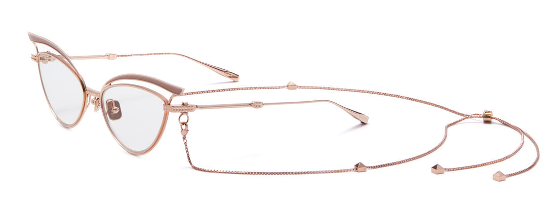Gold-tone cat-eye eyeglass frames with beige lenses and chain detailing