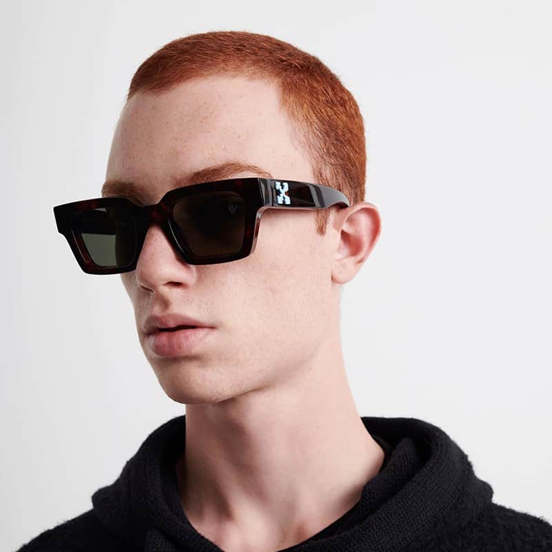 Black sunglasses on face, Off White logo temple, dark square lenses