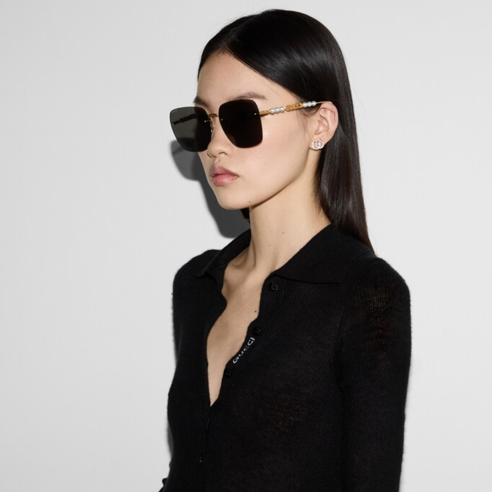 Gucci GG1257S Gafas de sol redondeadas con lentes marrones y rojos