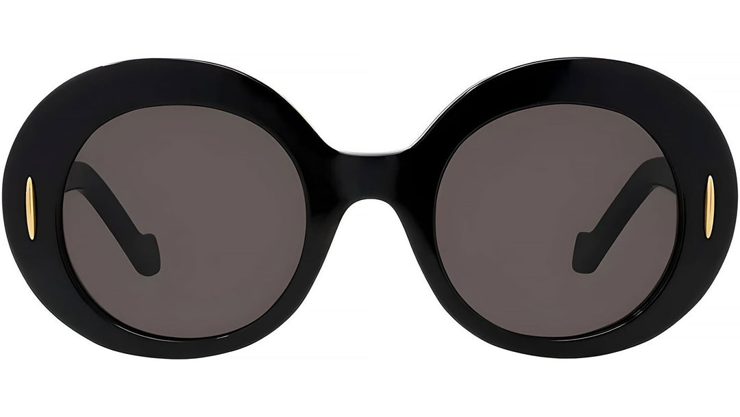 Round black sunglasses with dark lenses, gold-tone logo detail at temples
