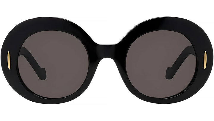 Round black sunglasses with dark lenses, gold-tone logo detail at temples