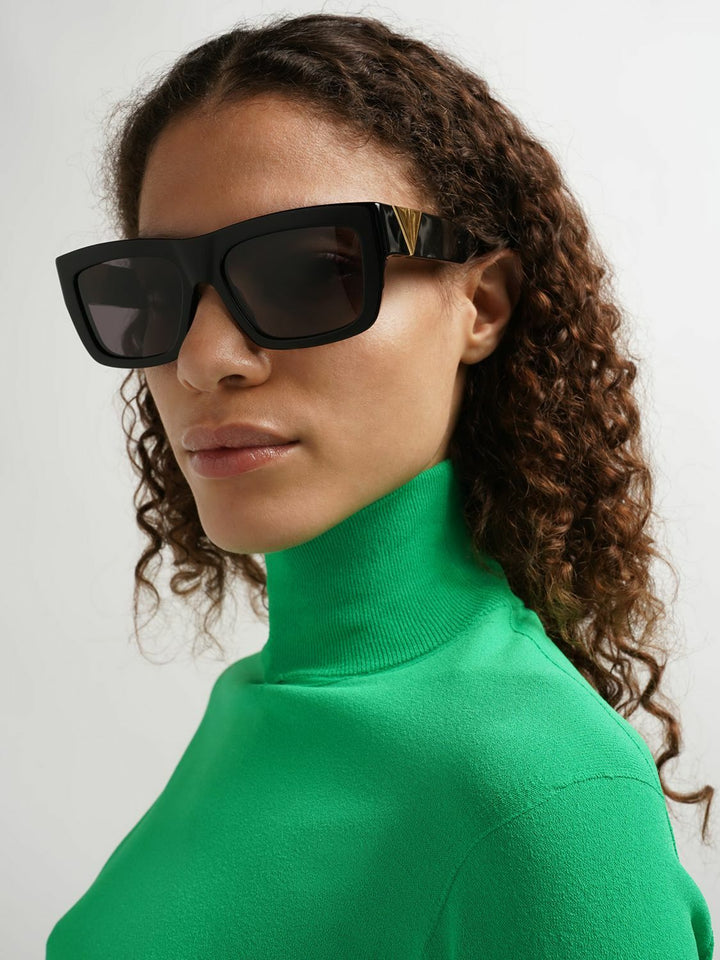 Bottega Veneta BV1178S black sunglasses in profile view with tinted lenses and gold tips