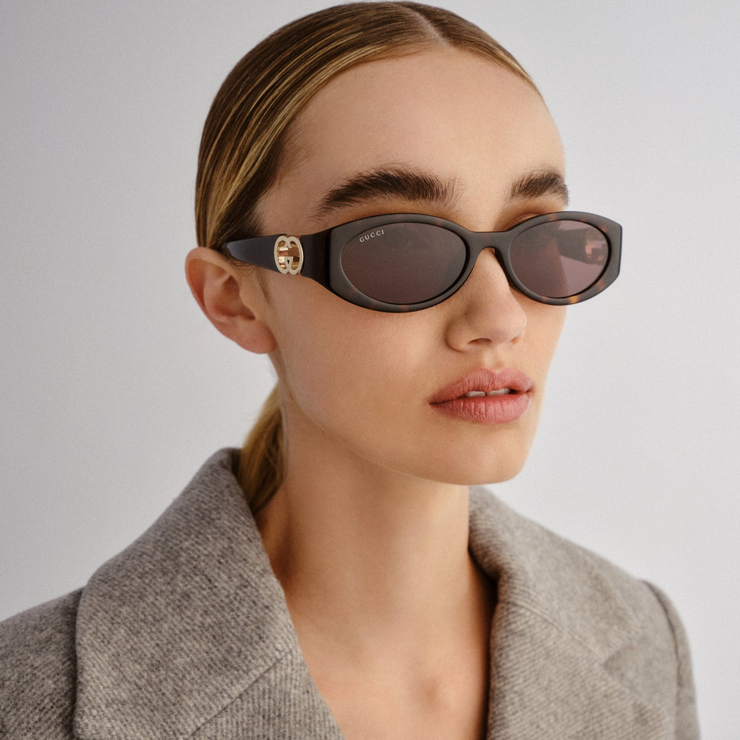 Gucci oval sunglasses with Havana brown frame, GG logo temples, dark lenses