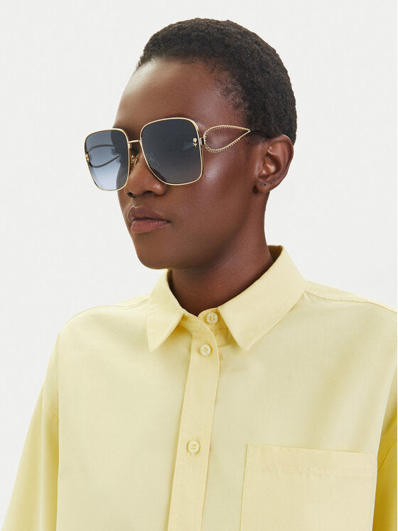 Etro square sunglasses worn by model, green frames with gold chain temples