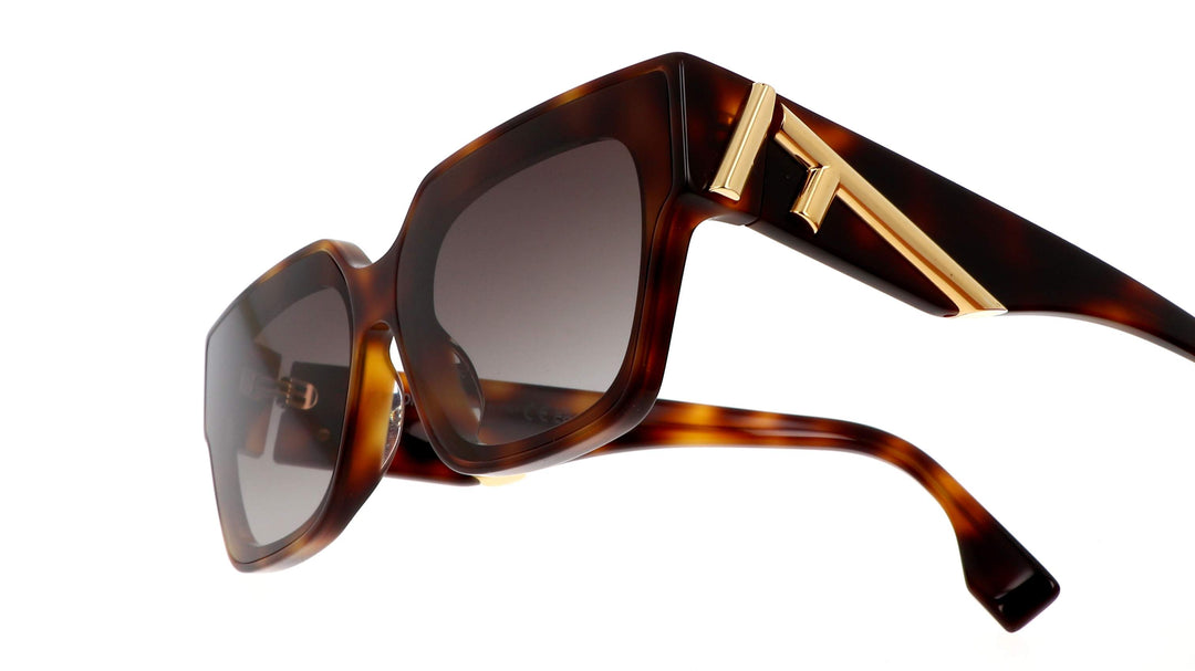 Fendi unisex sunglasses, side view, Havana tortoise frame with dark lenses and gold hinge