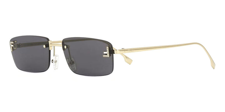 Rimless sunglasses with dark lenses and gold metal frame, black temple details