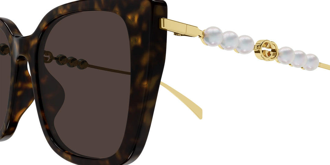 Gucci GG1257S Gafas de sol redondeadas con lentes marrones y rojos