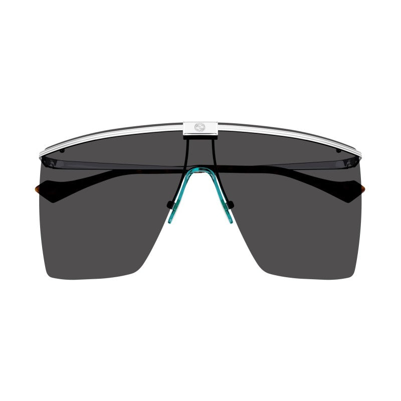 Rimless shielded sunglasses with dark lenses and turquoise bridge detail